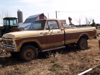 an old 1977 Ford F250 brown and tan pickup