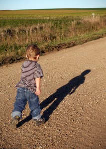 Youngest son running down the gravel road