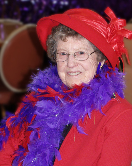 Grandma on her 80th birthday with her red hat and purple boa