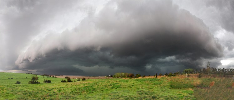 a large storm cloud near a nebraska farm