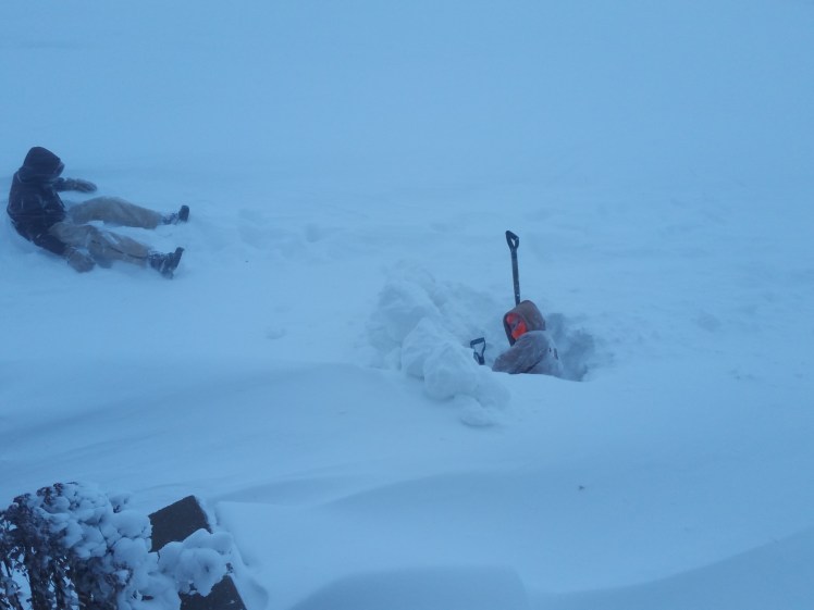 boys playing in snow drifts in the blizzard of 2016