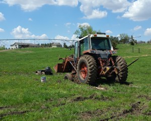 four wheeler and tractor stuck in mud
